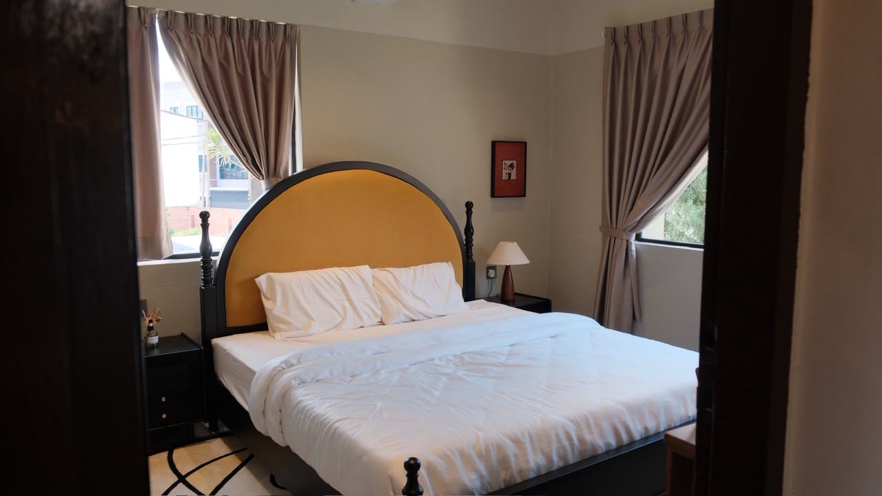 Bedroom with arched headboard