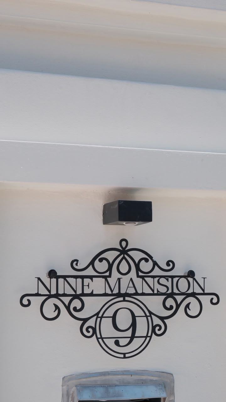 Nine Mansion number 9 plaque