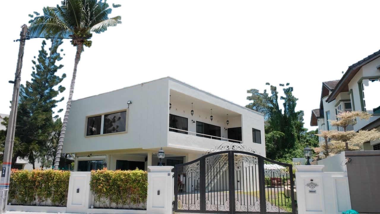 Nine Mansion, a white modern two storey house behind a black wrought iron gate